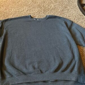 It’s a Men’s grey crewneck
